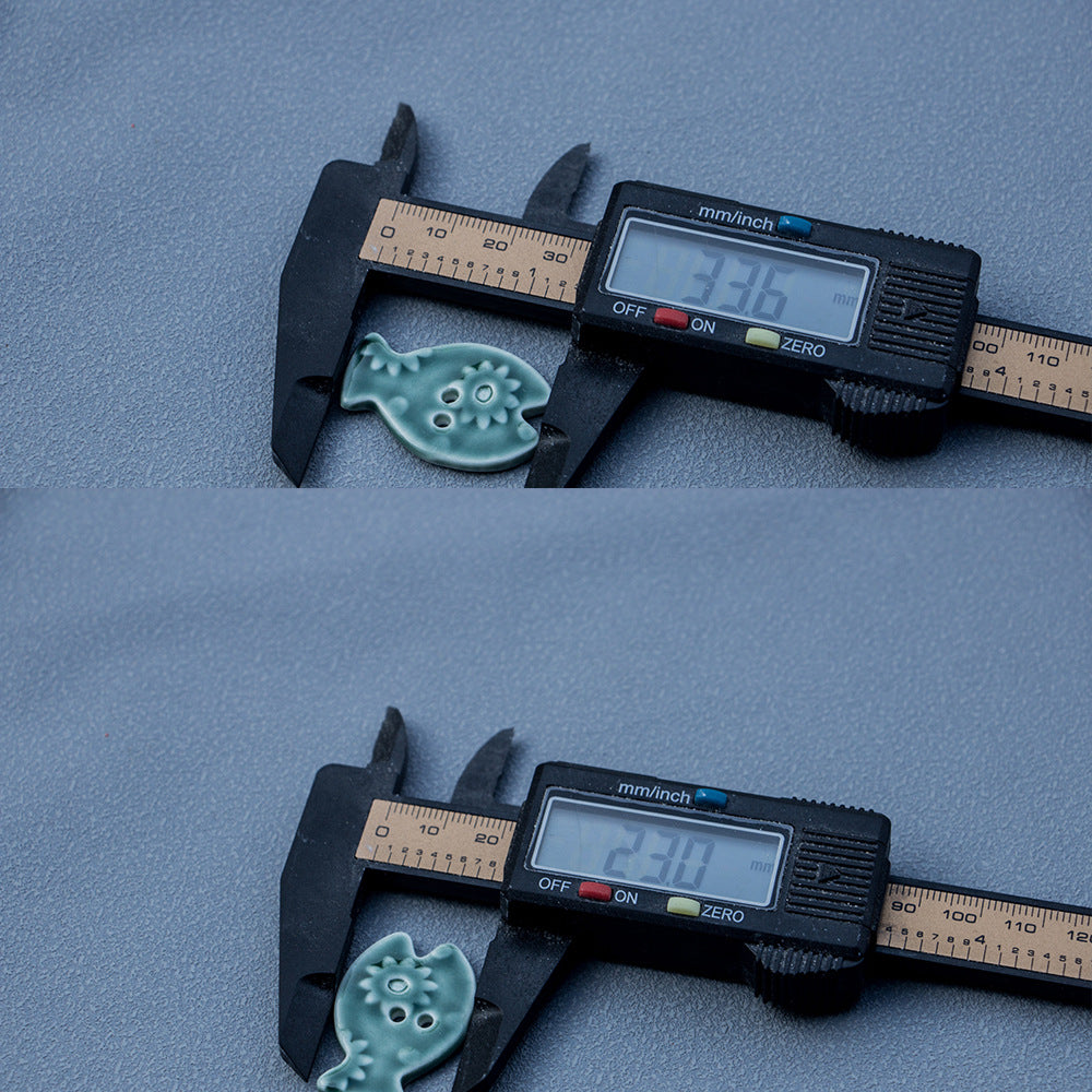 33mm grøn mosfarvet fiskformede 2-huls keramiske DIY-knapper 6 stk