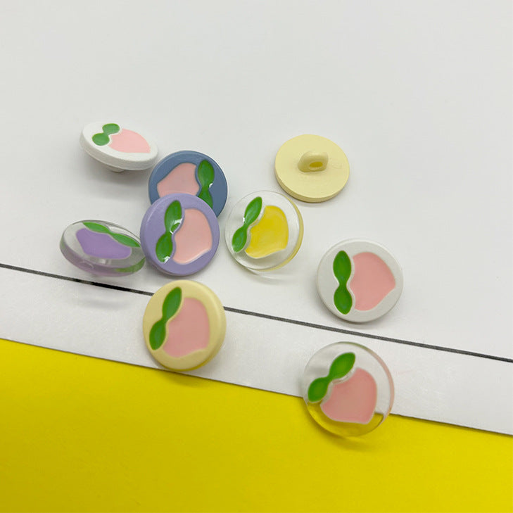 15/18mm värvilised multifilmilikud virsiku mustriga plastnööbid varrastega 70 pakis