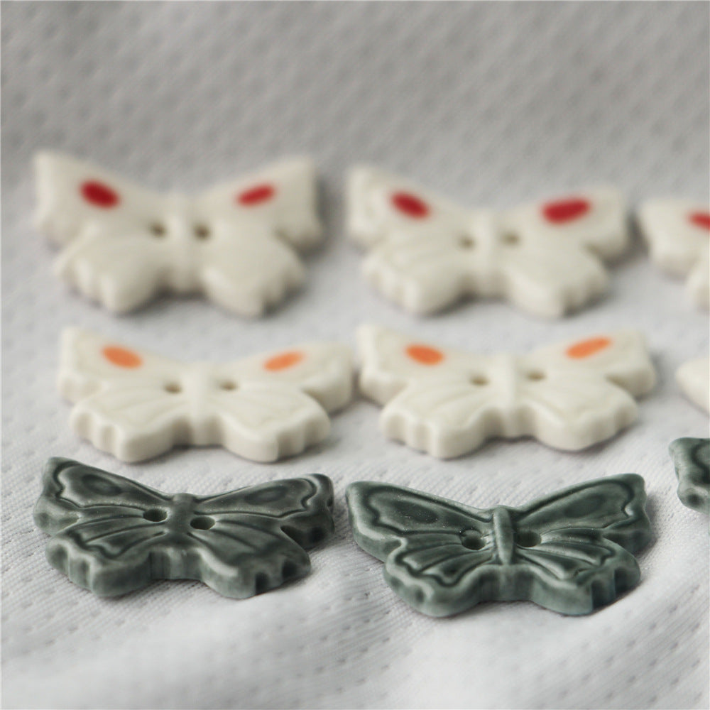 Bottoni in ceramica a forma di farfalla 25mm con 2 fori bianchi e grigio scuro per accessori per borse 6 pezzi