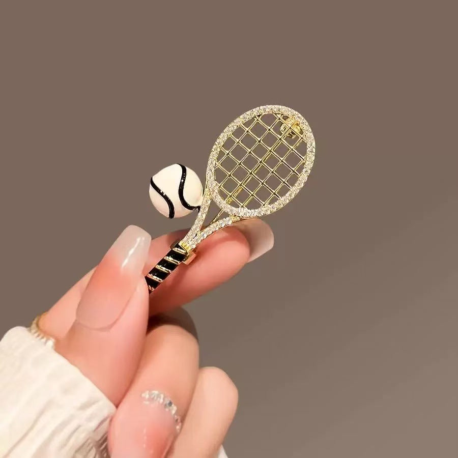 Tennis racket and ball brooch pin with textured gold net frame