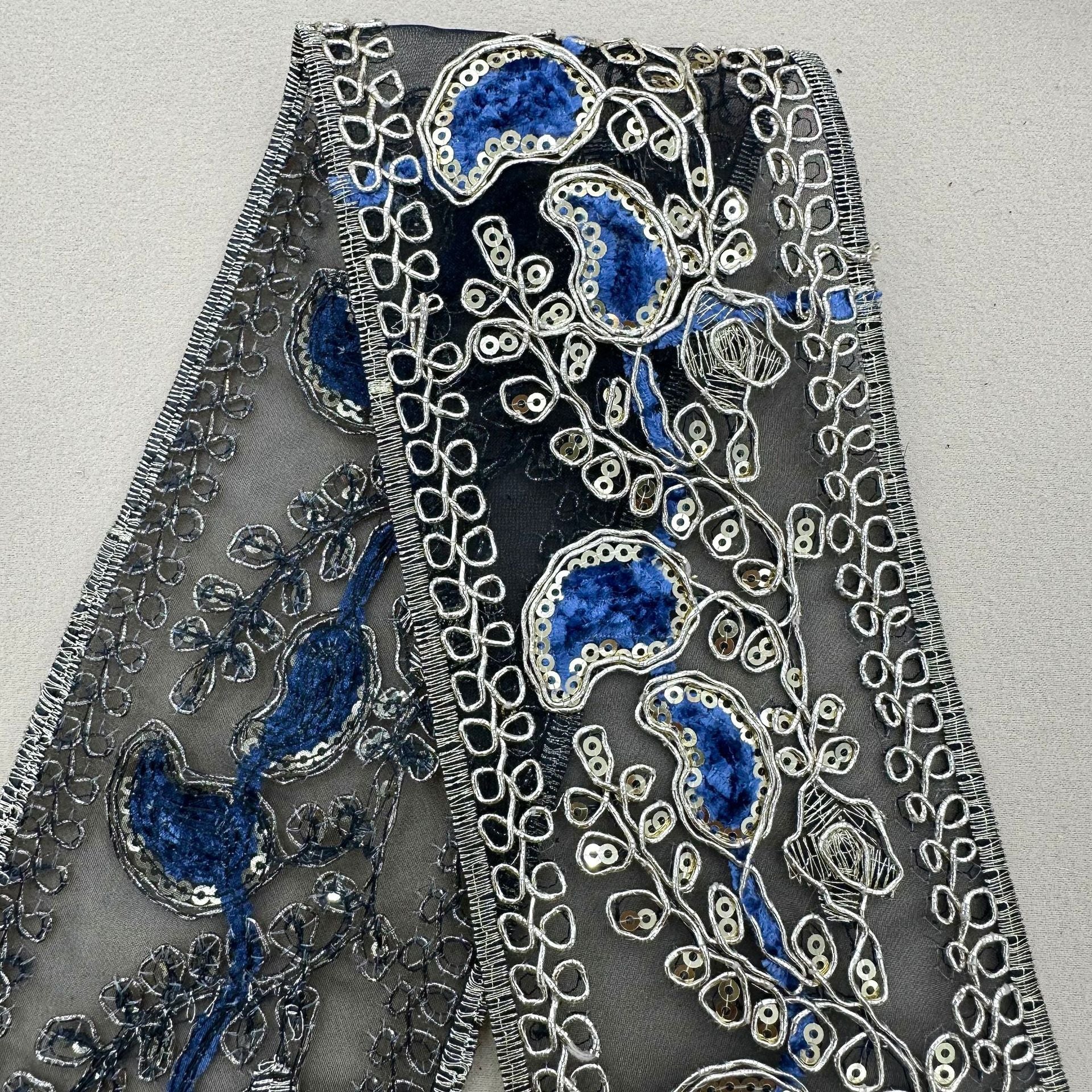 Wide sequin embroidery lace trim with bright blue oval medallions and silver edge