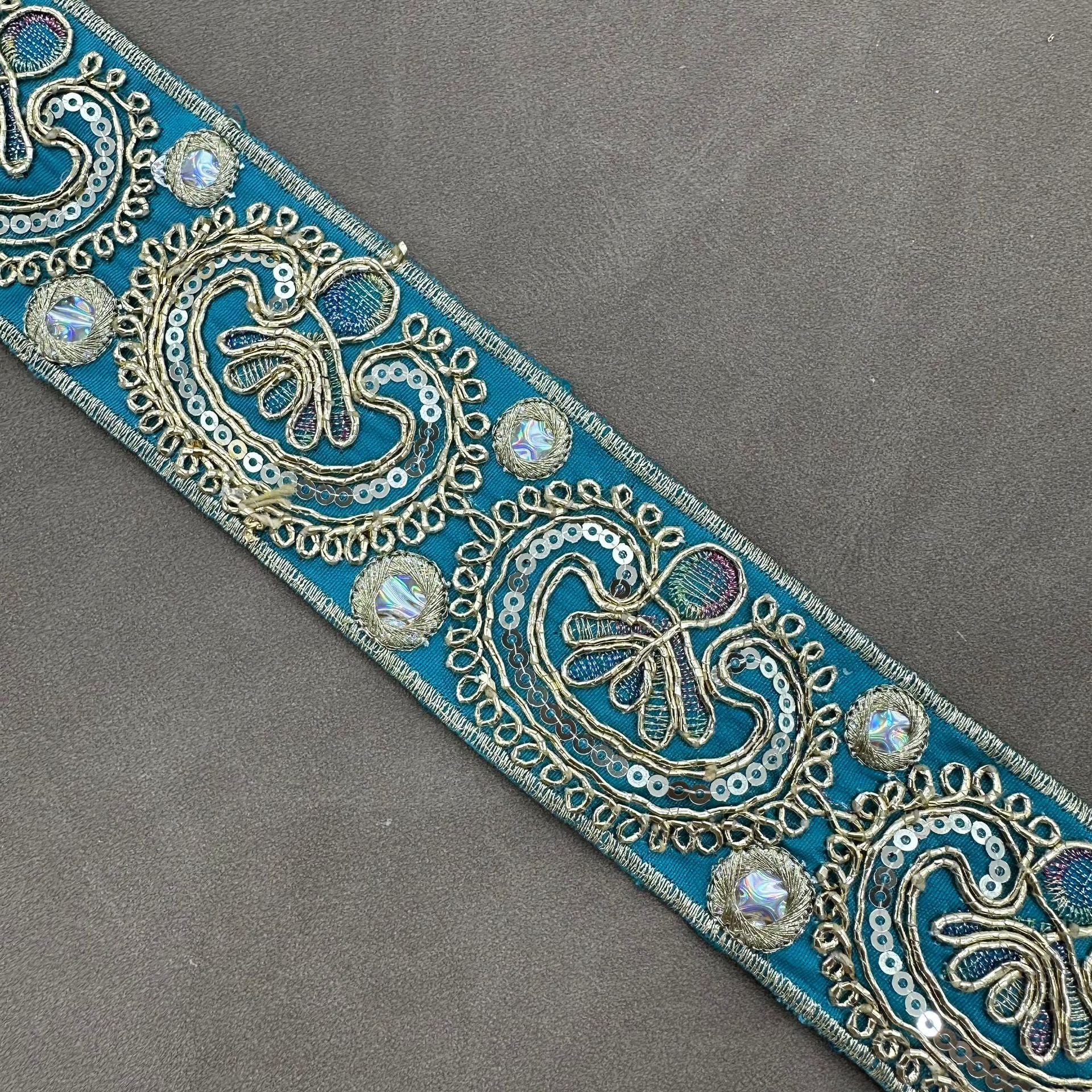 Teal embroidered trim with paisley sequin cord details and gold-toned accents