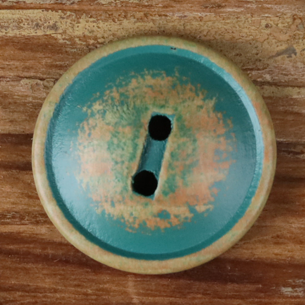 Round blue wood 2-hole button with two dark holes, close-up