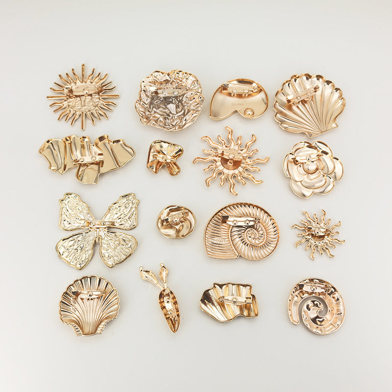 Gold brooch set of 16 irregular metal safety pins, assorted shell and flower shapes