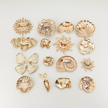 Gold brooch set of 16 irregular metal safety pins, assorted shell and flower shapes