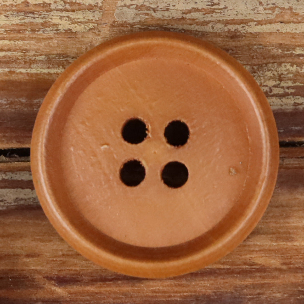 Blue-purple round wood button with four holes, close-up