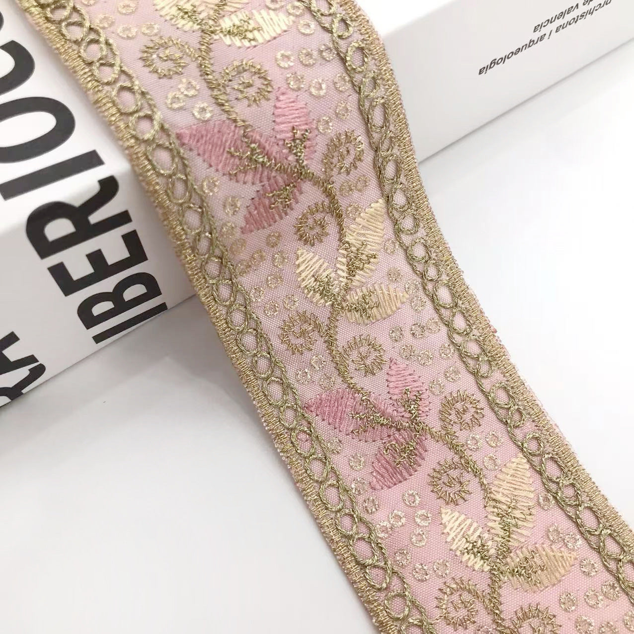 Pink and gold embroidered trim ribbon with sequined leaf motifs and chain trim border