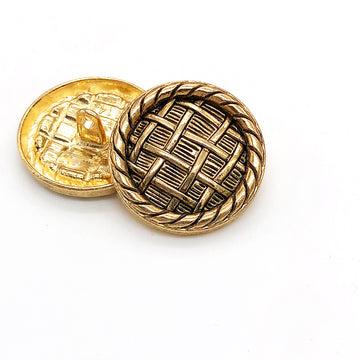 Round metal shank buttons, gold with black bamboo weave pattern.