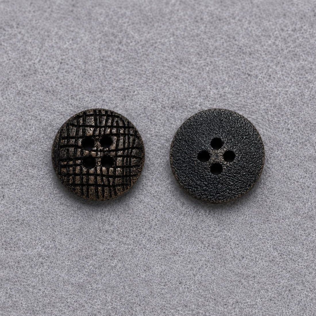 Dark brown flat round wood button with carved grid texture and four holes