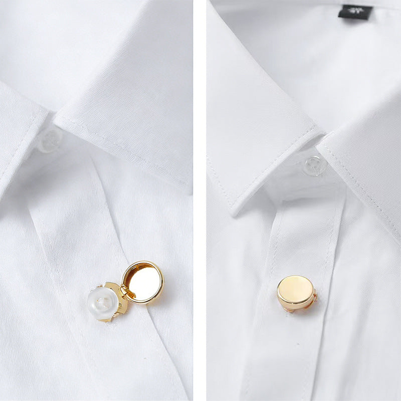 Snap-on cuff buttons on white cuff, gold-tone brass, round with small center fastener
