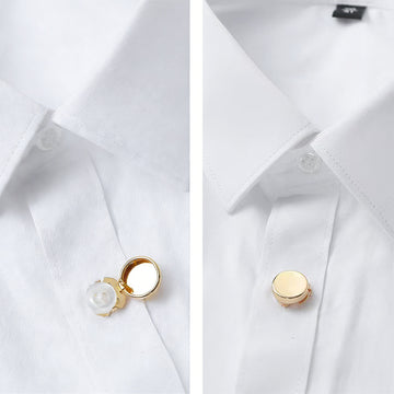 Snap-on cuff buttons on white cuff, gold-tone brass, round with small center fastener