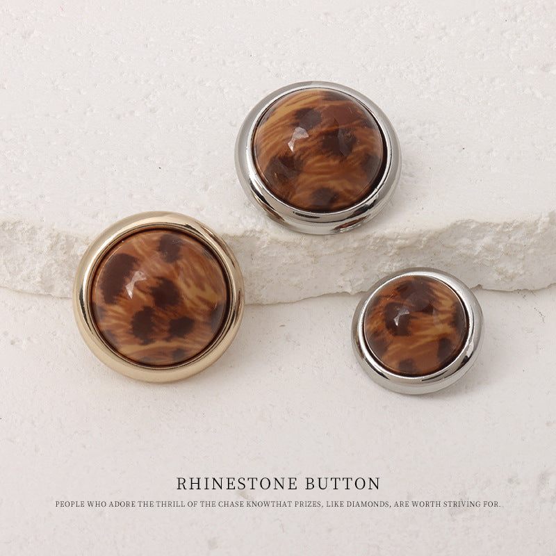 Three leopard-print resin mushroom buttons, brown pattern, gold and silver metal rims (front)