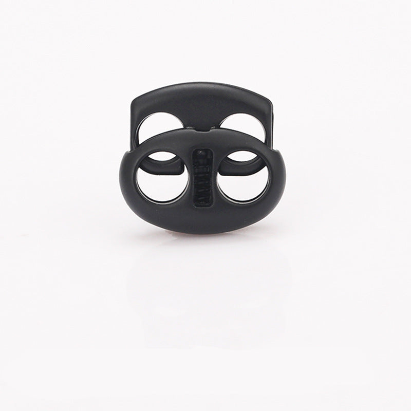 Black oval pig nose two-hole metal cord lock, centered front view of clasp