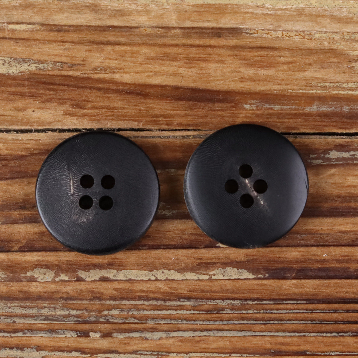 Ash-Fired Black Natural Horn Buttons 4-Hole | Pack of 20