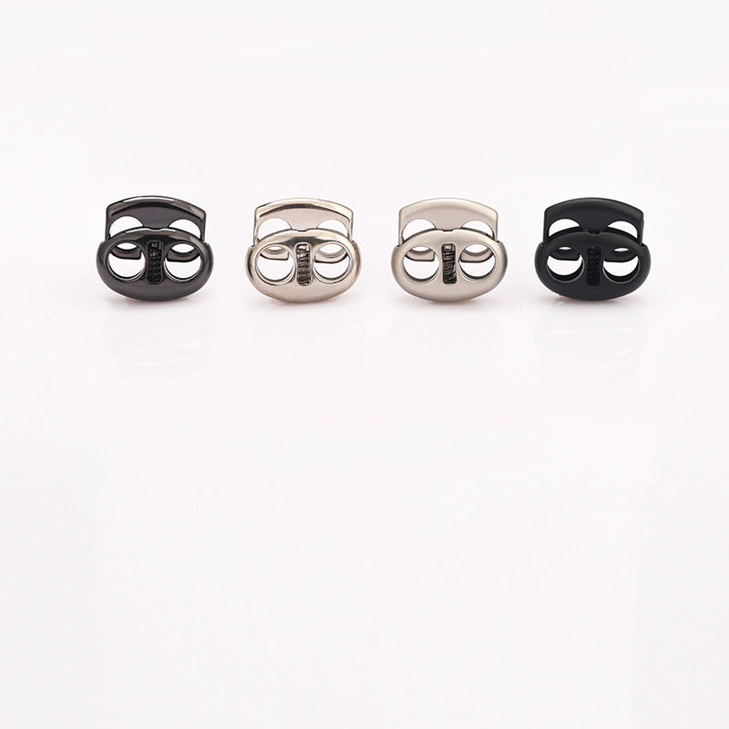 Set of oval pig nose two-hole metal cord locks in black, silver, and gunmetal