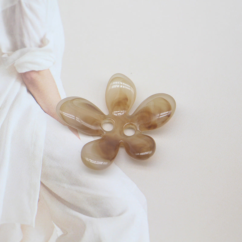 Beige/brown ombré 5-petal resin flower sewing button, two-hole center.