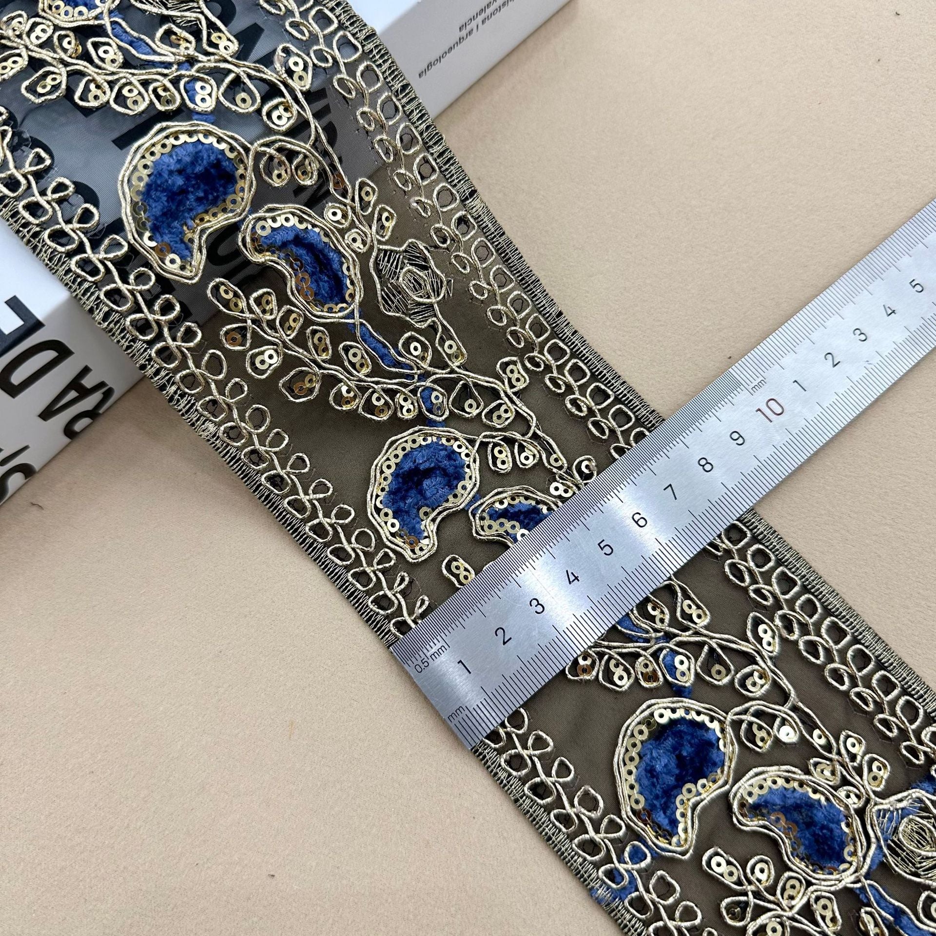 Navy sequin embroidered lace trim with ornate oval motifs, 8 cm wide