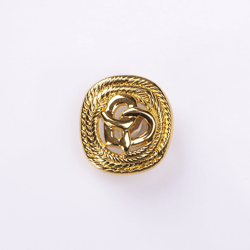 Gold rope-edge hollow heart metal shank button, close-up front design