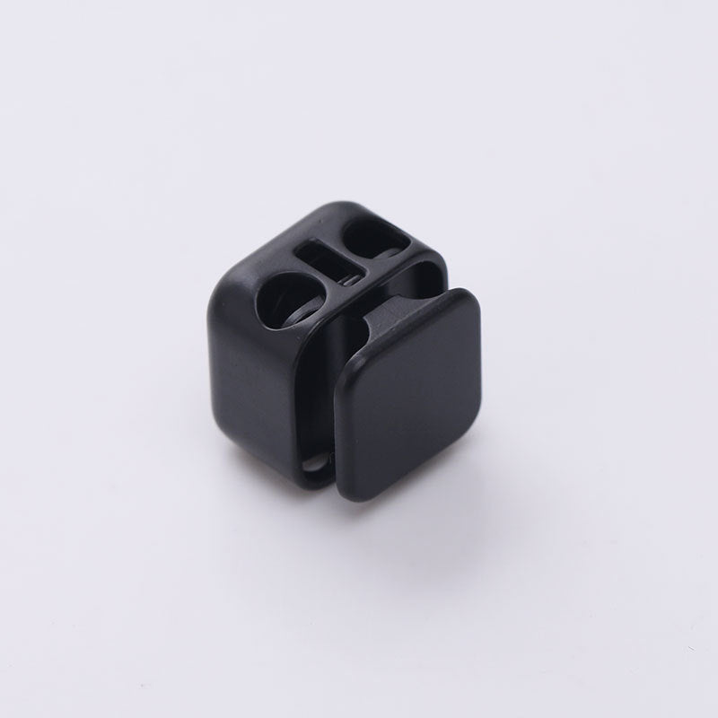 Black square two-hole metal spring cord lock, cylindrical with two openings