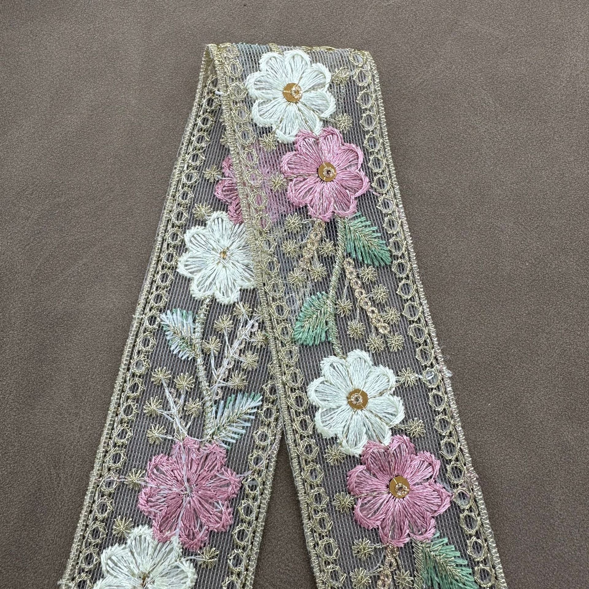 Floral pink mesh lace trim segment with sequins, gold border and white/pink flower clusters