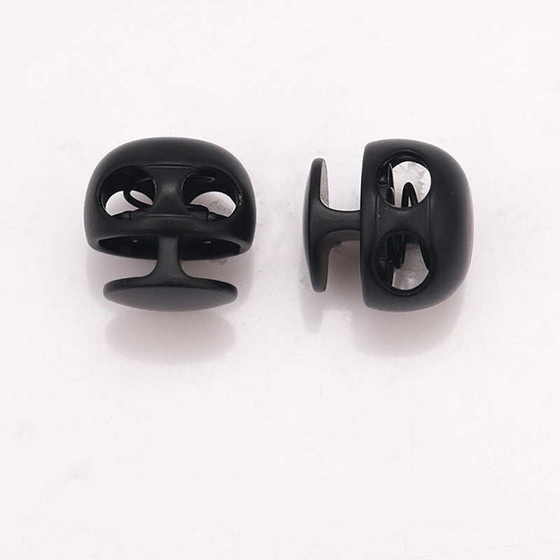 Black ball-shaped metal spring toggle stopper, front and back side angles