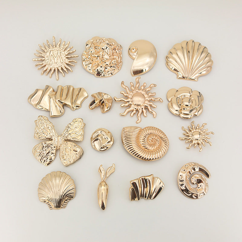 Gold brooch set of 16 irregular metal safety pins, sunburst and shell designs