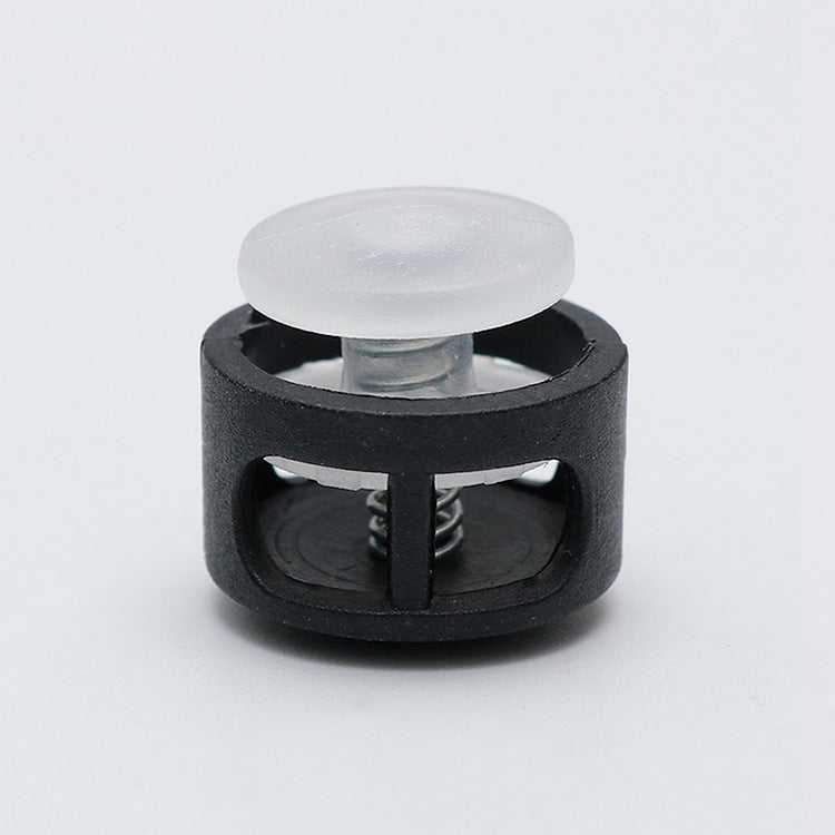 Plastic cord lock toggle with spring, light white cap and black housing