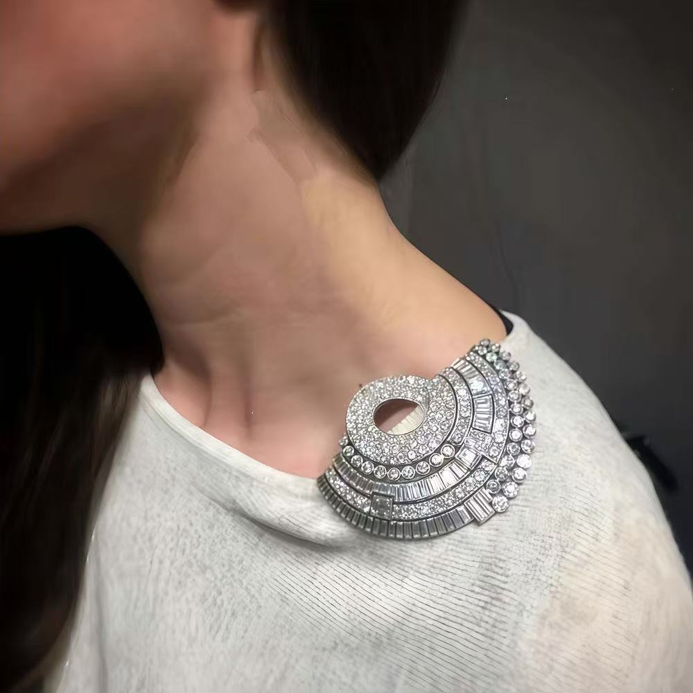 Fan-shaped rhinestone clip brooch with circular center cutout