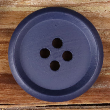 Blue-purple round wood button with four holes, close-up