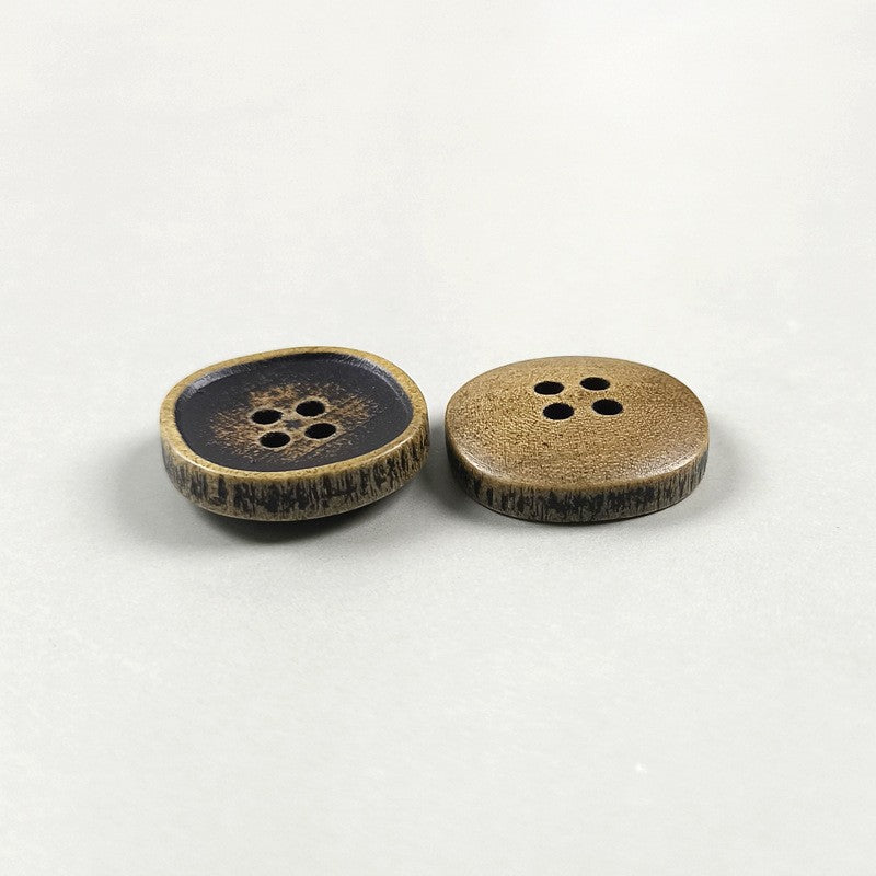 Dark wood four-hole button with brown rim, round concave face