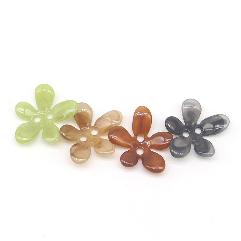 Assorted 5-petal resin ombré sewing buttons set, each with two holes.