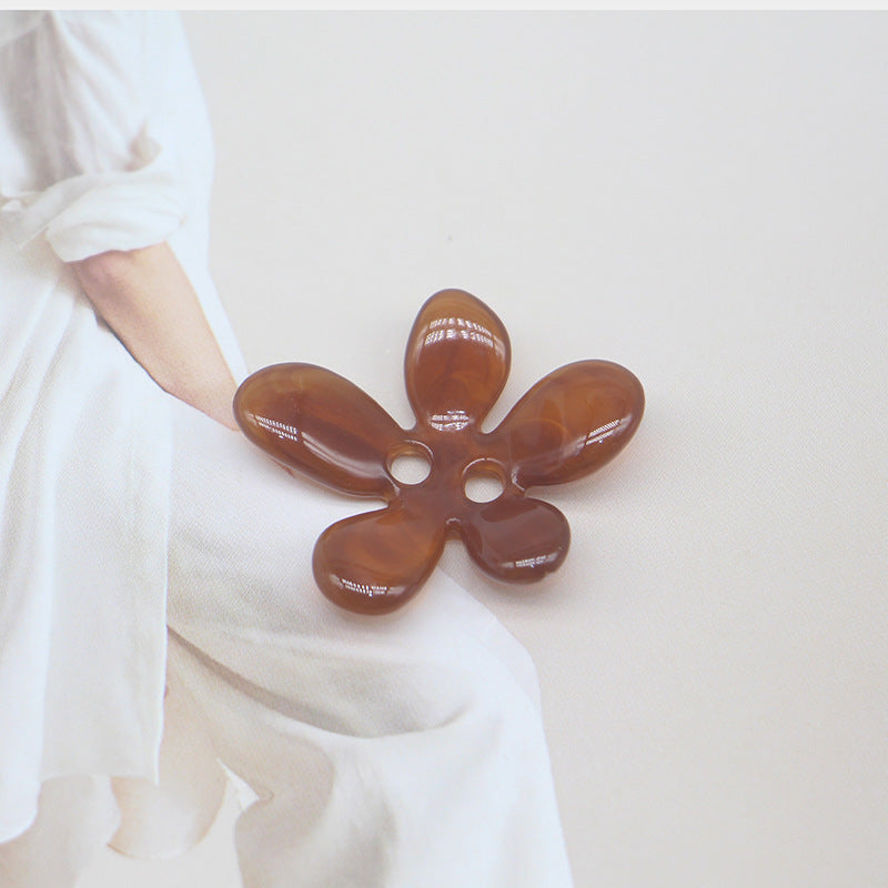 Brown ombré 5-petal resin flower sewing button, two holes in center.