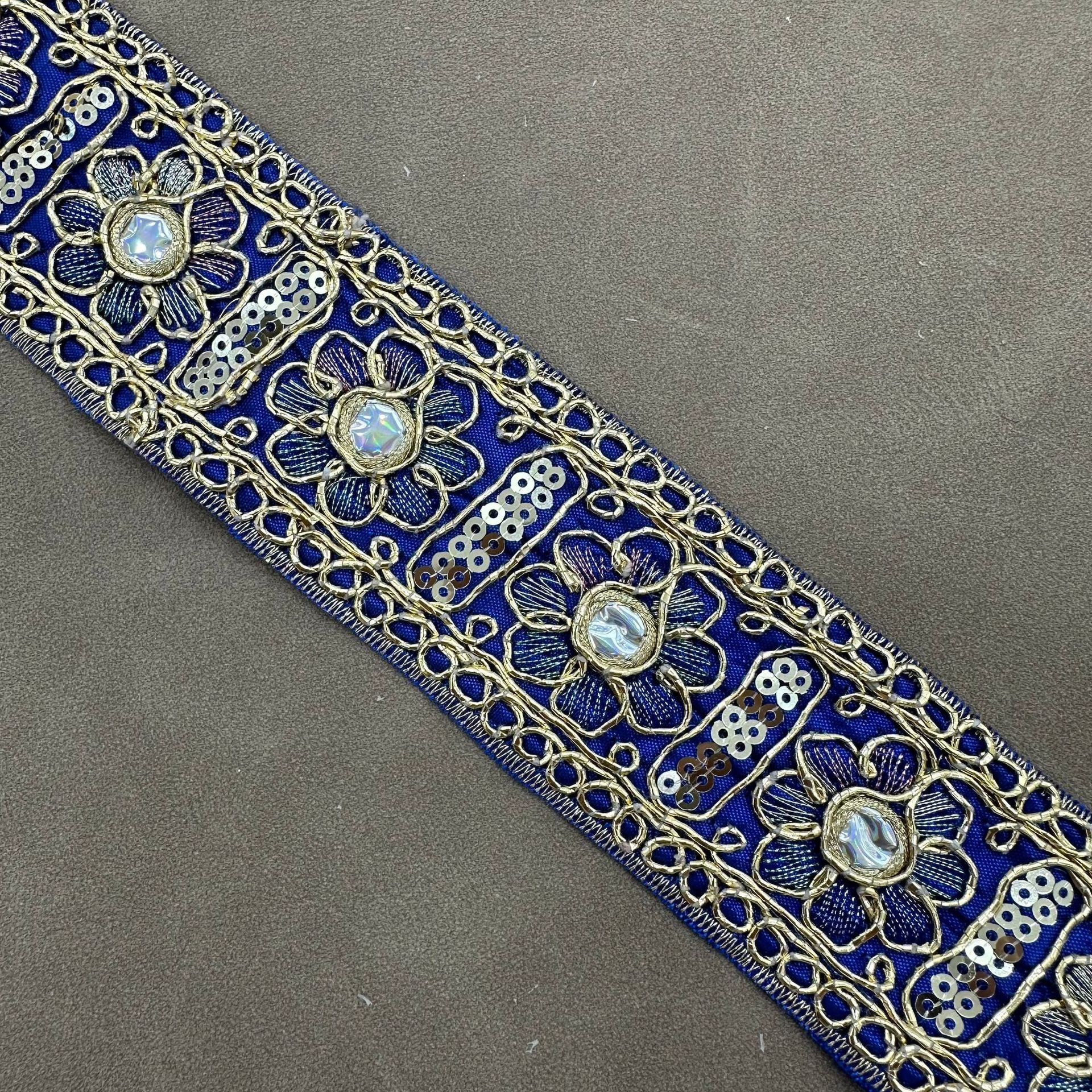 Sunflower Ethnic sequin trim, dark blue fabric with silver floral sequins and trim loops