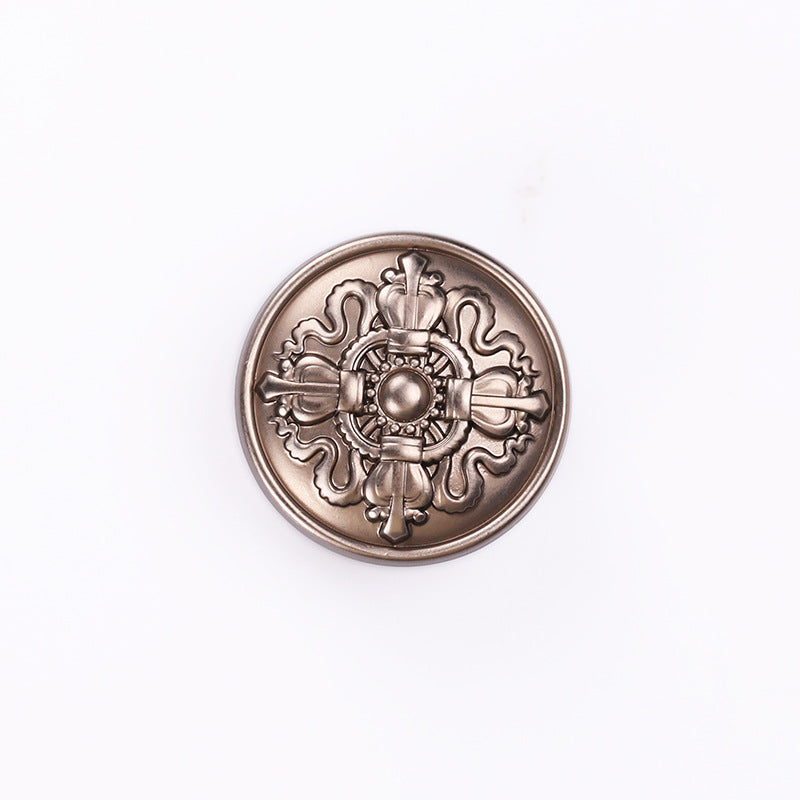 Tea-tone crown emblem round metal shank button, front view with central bead