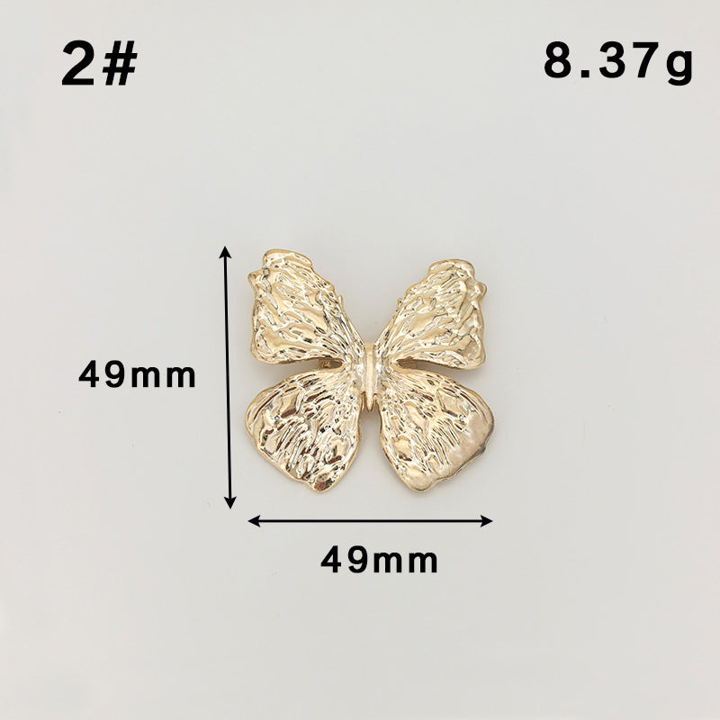 Gold butterfly metal brooch with safety-pin clasp