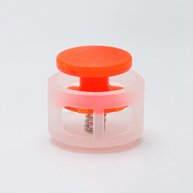 Plastic cord lock toggle with spring, orange cap and clear base