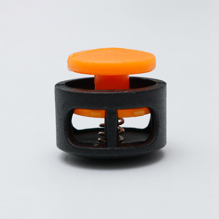 Plastic cord lock toggle with spring, orange cap and black housing