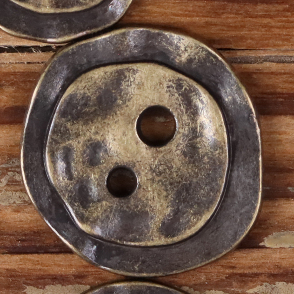 Bronze metal 2-hole button, irregular round face with two holes, textured finish.