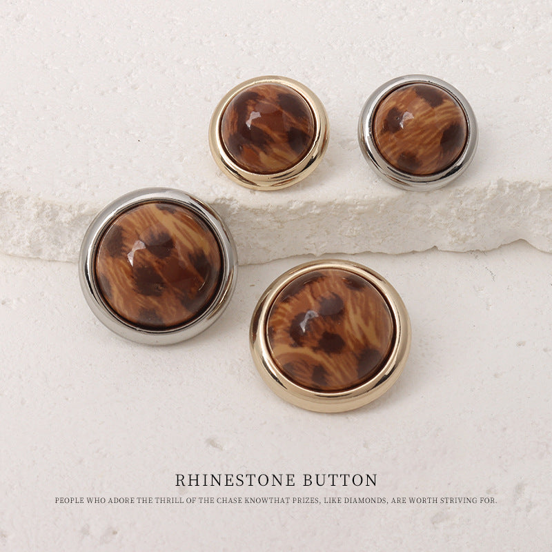 Assorted leopard-print resin mushroom buttons, brown fronts, gold and silver metal rims