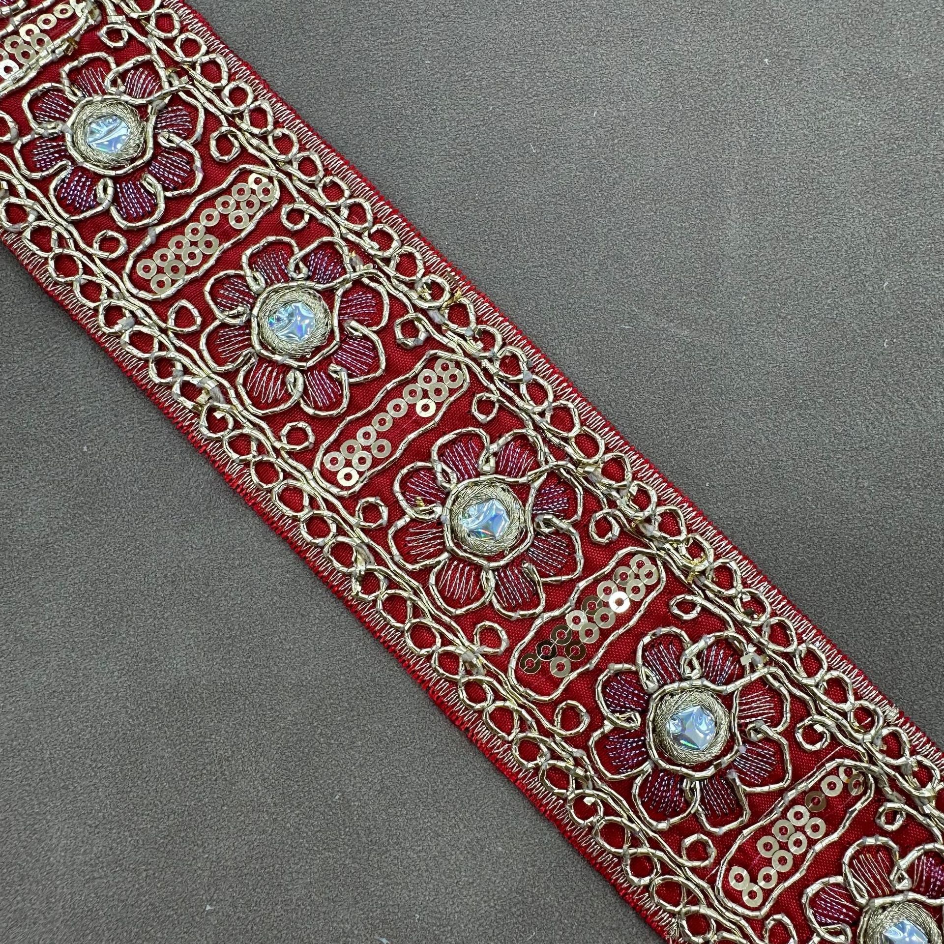 Sunflower Ethnic sequin trim, red fabric with silver floral sequin medallions