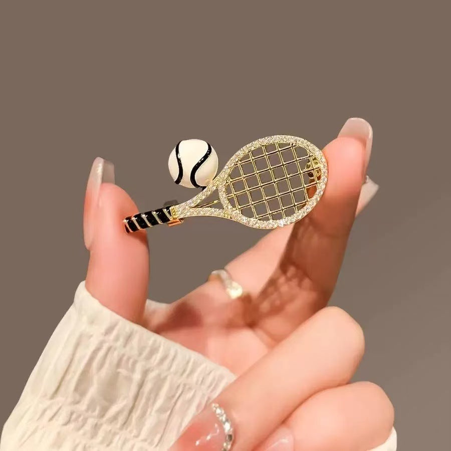 Tennis racket and ball enamel lapel pin, gold-tone net detail