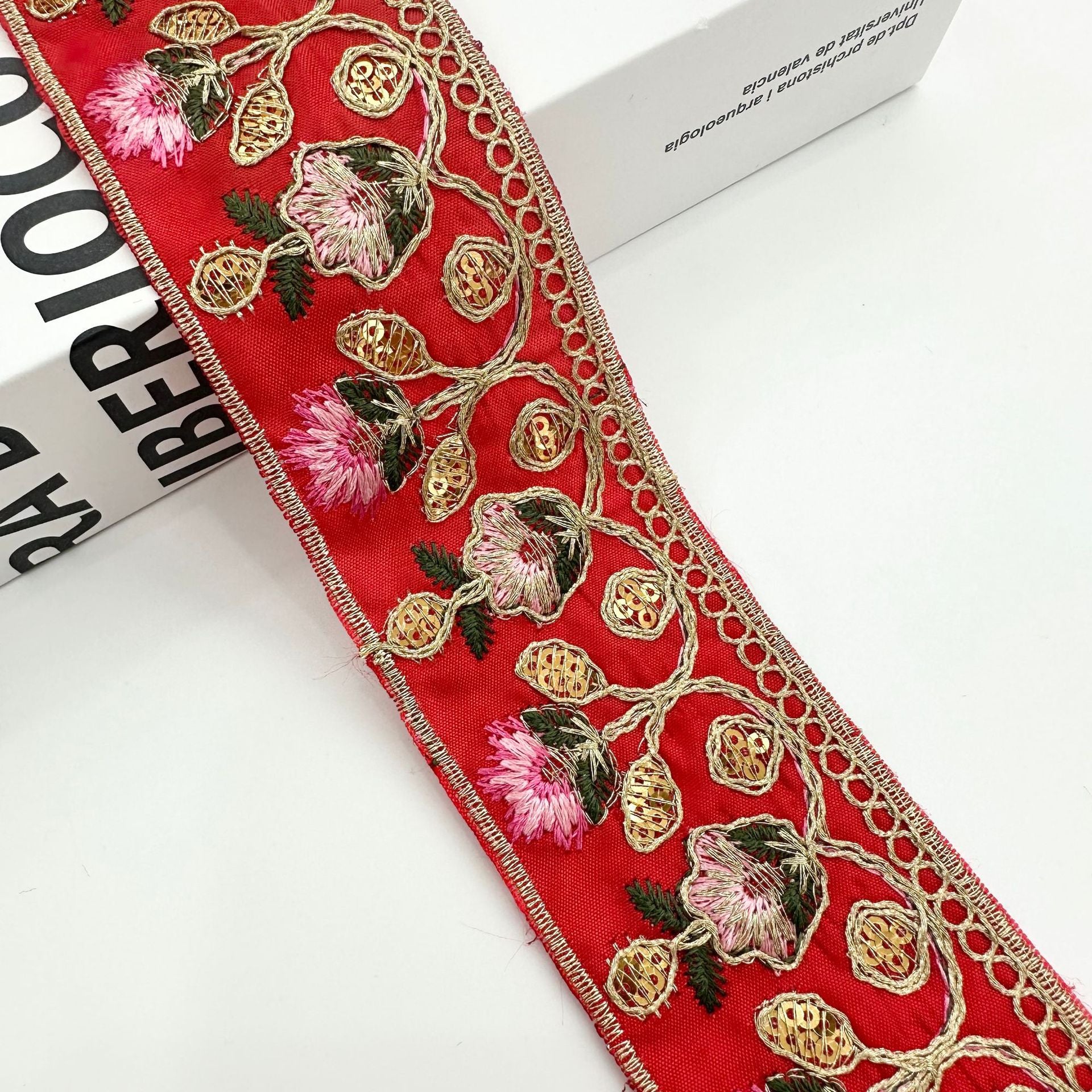 Red embroidered lace trim ribbon with pink flowers and gold bead vine embroidery
