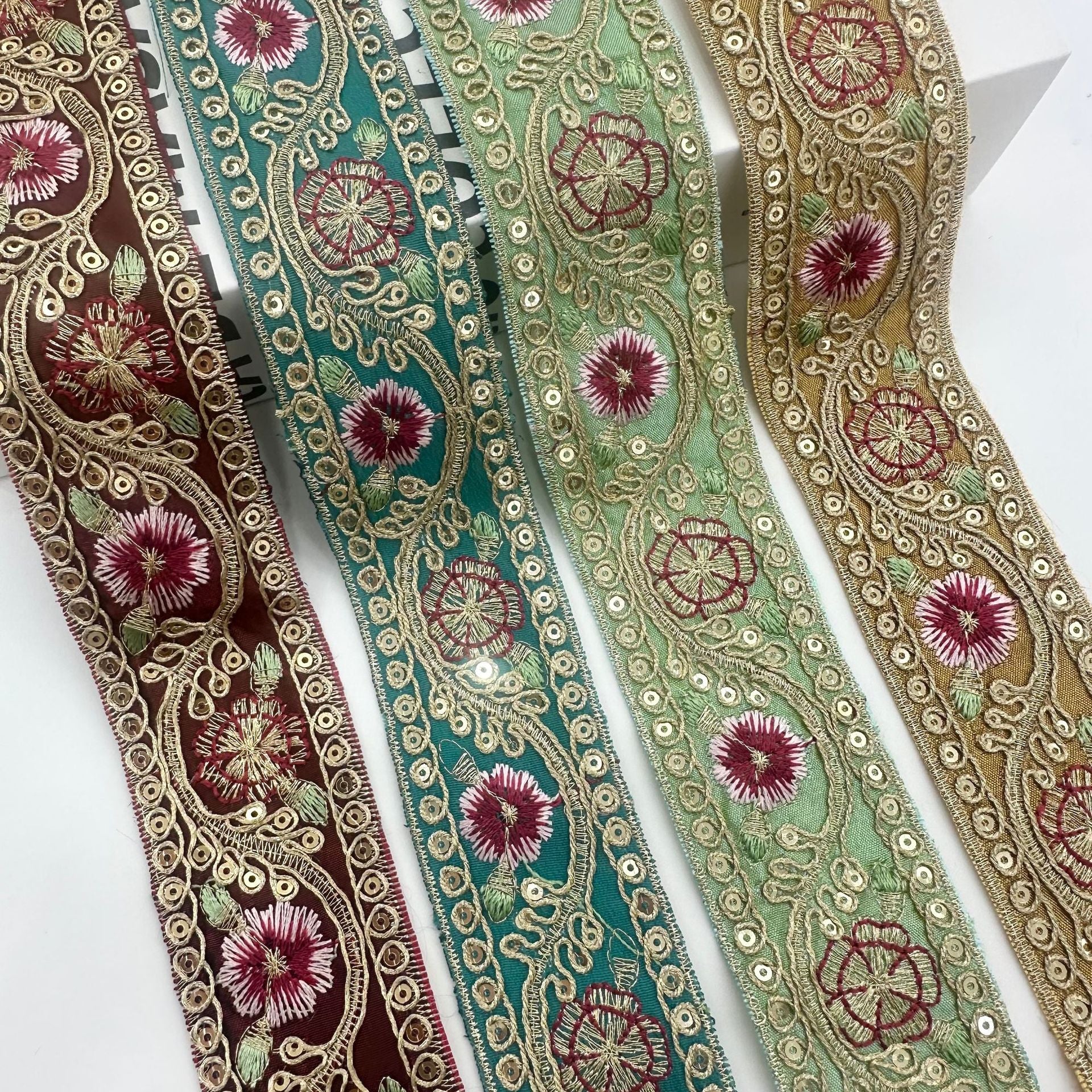 Embroidered cord trim, 4cm wide, teal and green panels with maroon floral embroidery