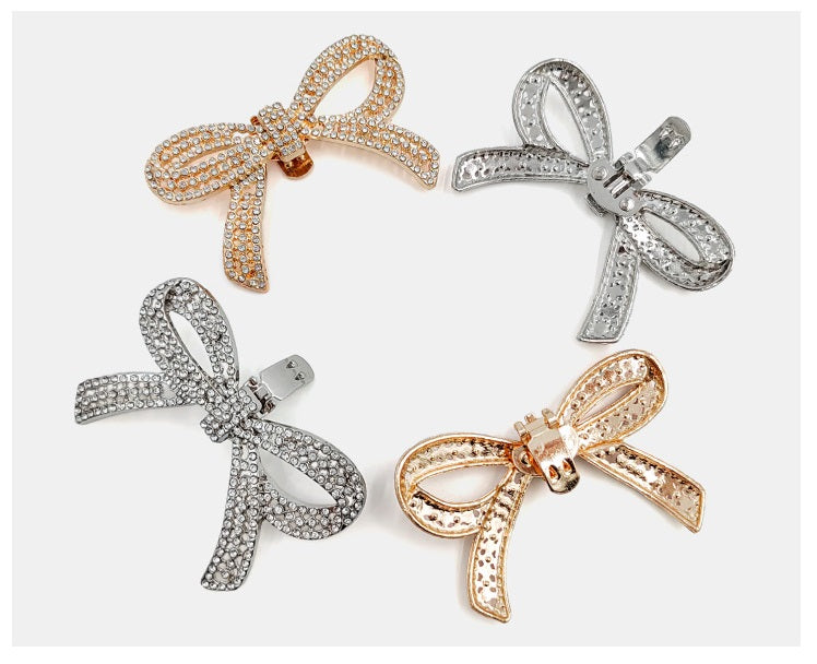 4-pack rhinestone bow clips: gold, silver, and dark tones with metal snap backs
