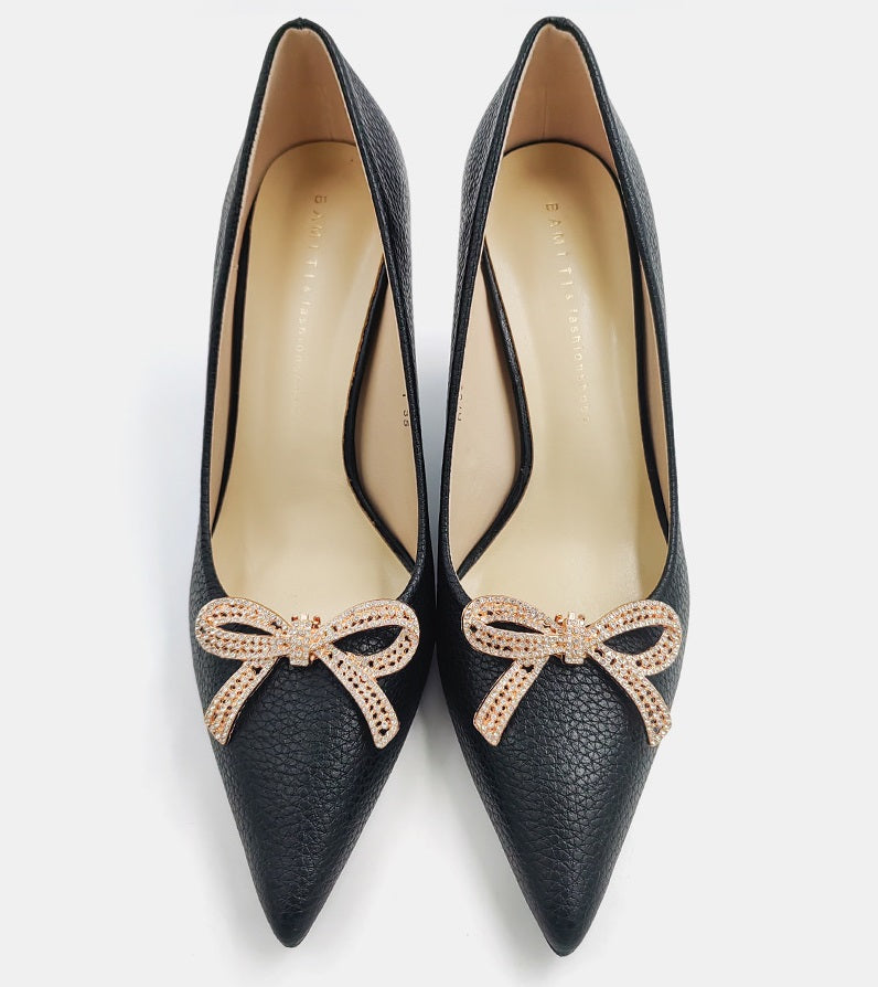 Black flats with rhinestone bow clips, gold-tone crystal bow on front toe